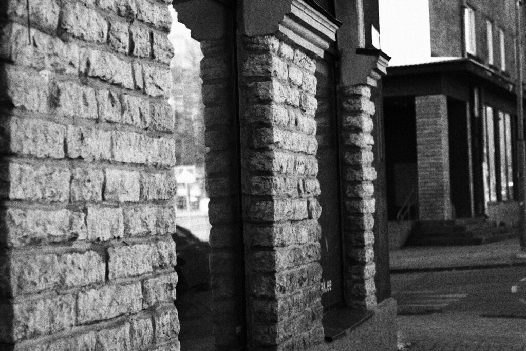 a black and white photo of a brick building